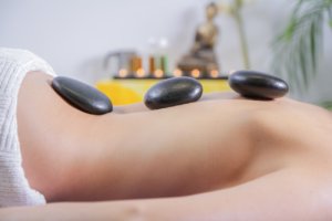 Woman during stone massage in a spa